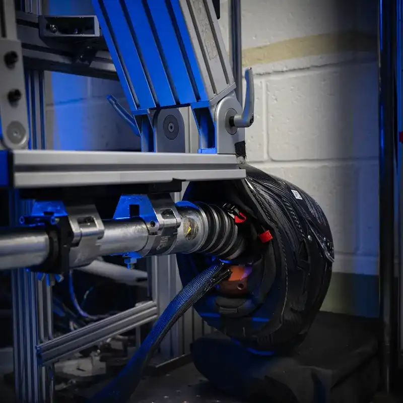 Ruroc helmet mounted in a crash test drop rig