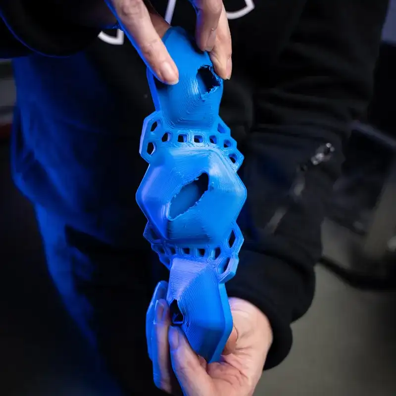 Close-up of Rheon™ adaptive impact material held in hand